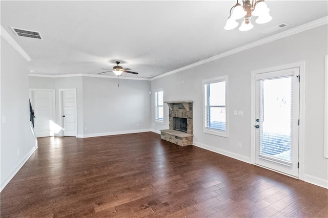 149 Elkins Blvd, Locust Grove, GA 30248 - unfurnished living room featuring ornamental molding, a stone fireplace, ceiling fan with notable chandelier, and a wealth of natural light