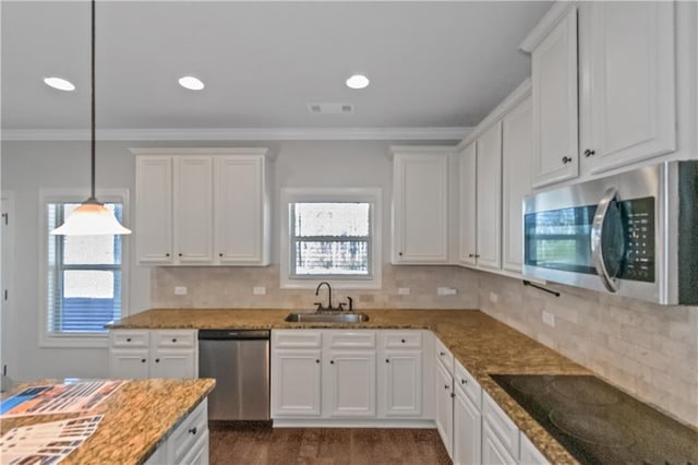 149 Elkins Blvd, Locust Grove, GA 30248 - kitchen featuring sink, white cabinetry, crown molding, hanging light fixtures, and appliances with stainless steel finishes