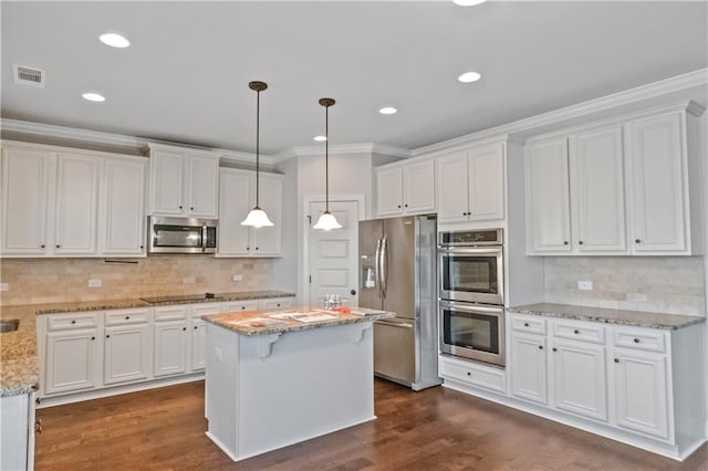 149 Elkins Blvd, Locust Grove, GA 30248 - kitchen featuring appliances with stainless steel finishes, pendant lighting, and white cabinets