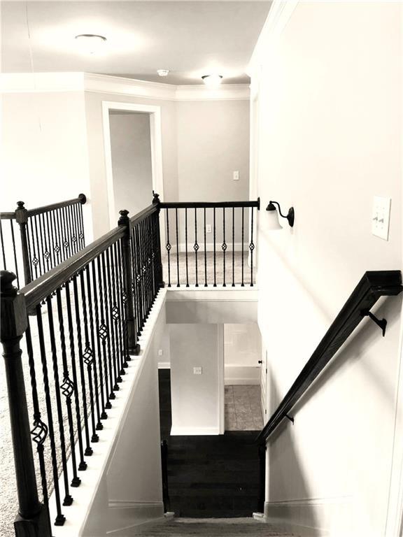 149 Elkins Blvd, Locust Grove, GA 30248 - staircase with ornamental molding