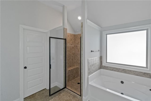 149 Elkins Blvd, Locust Grove, GA 30248 - bathroom with lofted ceiling and independent shower and bath