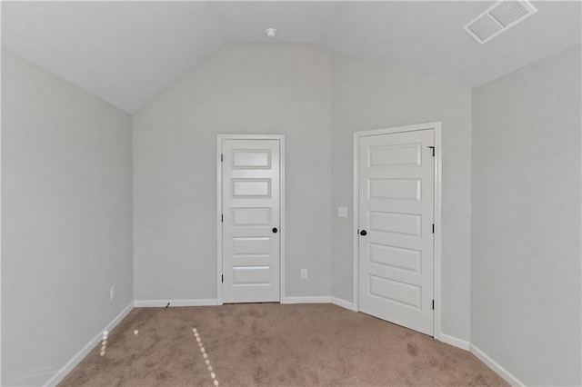 149 Elkins Blvd, Locust Grove, GA 30248 - carpeted empty room with vaulted ceiling