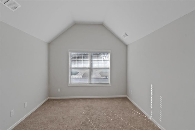 149 Elkins Blvd, Locust Grove, GA 30248 - carpeted spare room with lofted ceiling