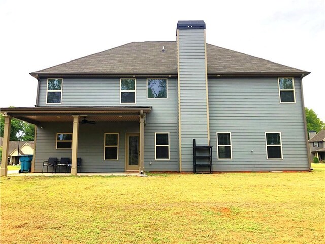 149 Elkins Blvd, Locust Grove, GA 30248 - back of house with a lawn, ceiling fan, and a patio area