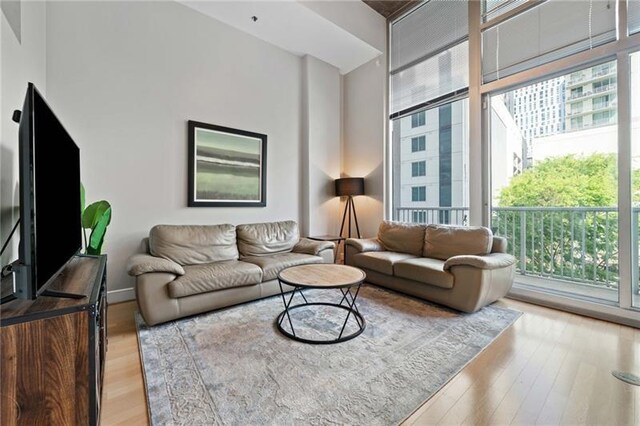 44 Peachtree Pl NW Unit 528, Atlanta, GA 30309 - living room featuring light wood-type flooring