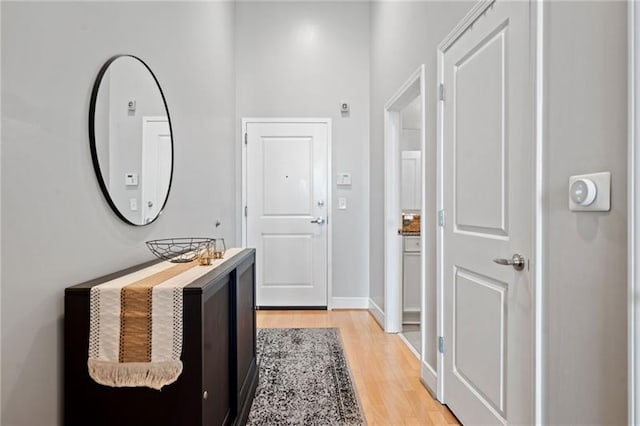 44 Peachtree Pl NW Unit 528, Atlanta, GA 30309 - hallway with baseboards and light wood-style floors