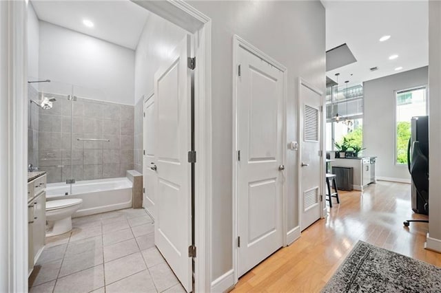 44 Peachtree Pl NW Unit 528, Atlanta, GA 30309 - bathroom with shower / bathtub combination, wood finished floors, and toilet