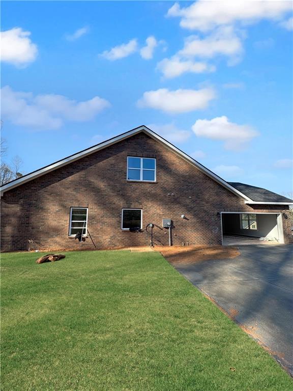 view of home's exterior featuring a lawn