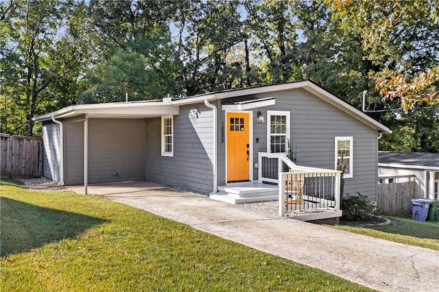 ranch-style house with a front yard