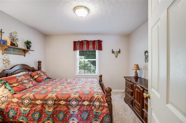 3359 Villa Ln, Douglasville, GA 30135 - carpeted bedroom with a textured ceiling
