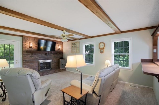 3359 Villa Ln, Douglasville, GA 30135 - carpeted living area featuring plenty of natural light, a fireplace, beamed ceiling, and ceiling fan