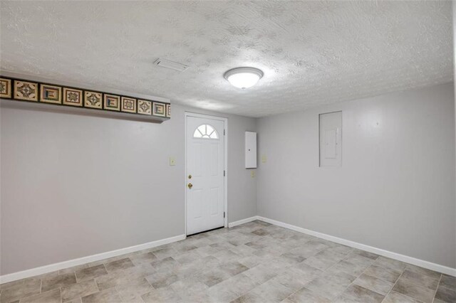 3359 Villa Ln, Douglasville, GA 30135 - entrance foyer with a textured ceiling and electric panel