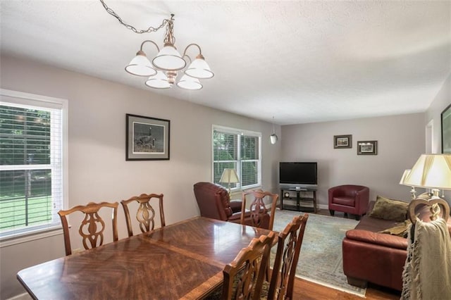 3359 Villa Ln, Douglasville, GA 30135 - dining area with a chandelier and a textured ceiling