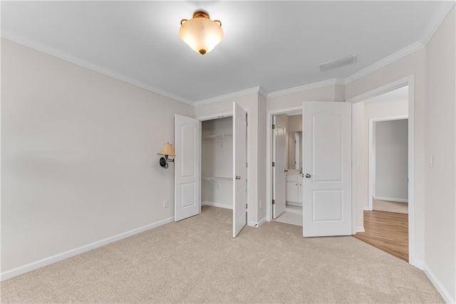 unfurnished bedroom with visible vents, baseboards, light colored carpet, ornamental molding, and a closet