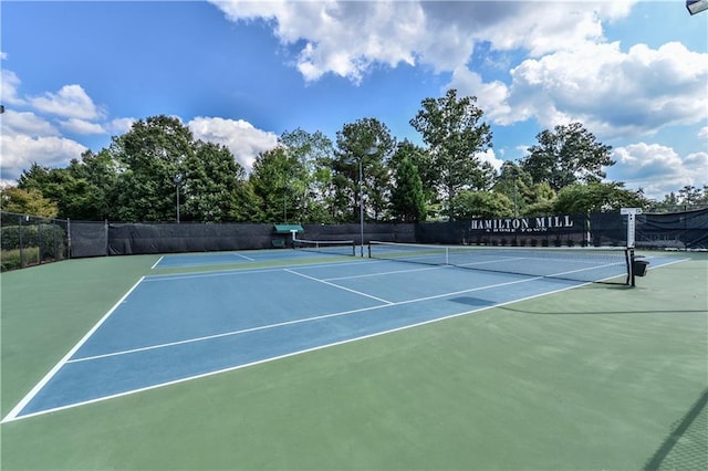 view of sport court with fence