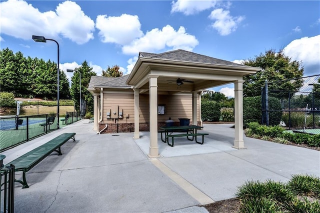 view of home's community with a patio and fence