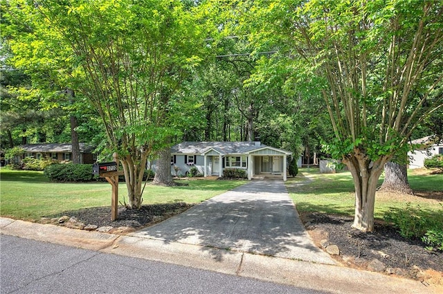 view of front facade featuring a porch, a front lawn, and concrete driveway