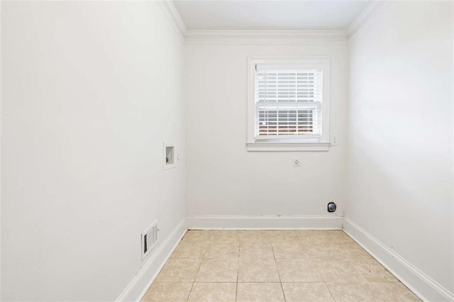 clothes washing area with washer hookup, electric dryer hookup, light tile patterned floors, and crown molding