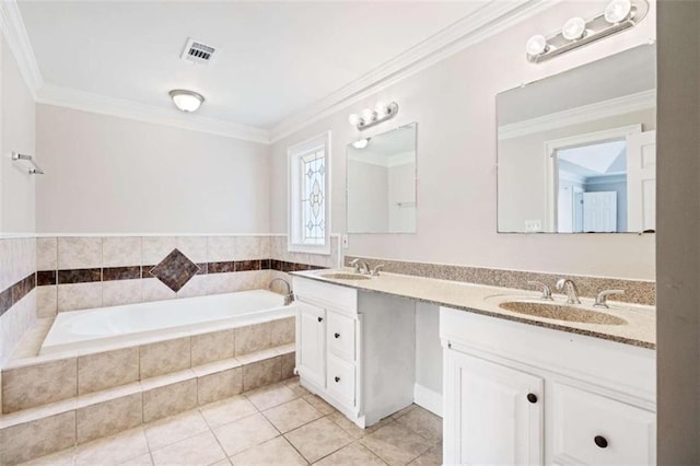 bathroom featuring vanity, tile patterned floors, crown molding, and tiled tub