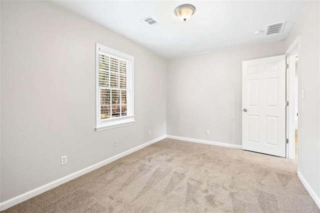 empty room with light colored carpet