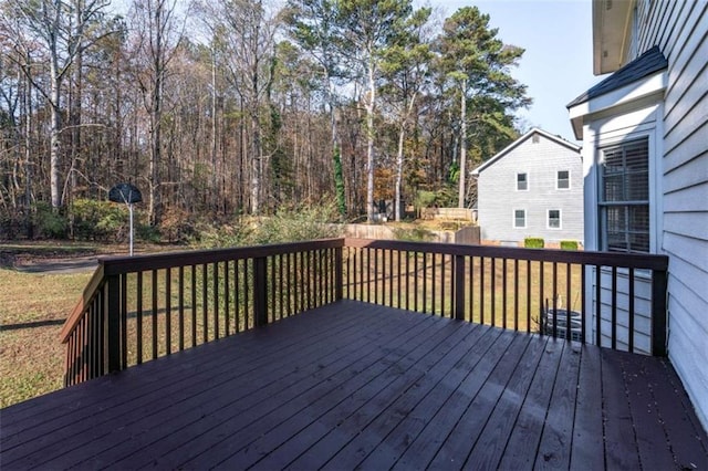 wooden terrace with a lawn