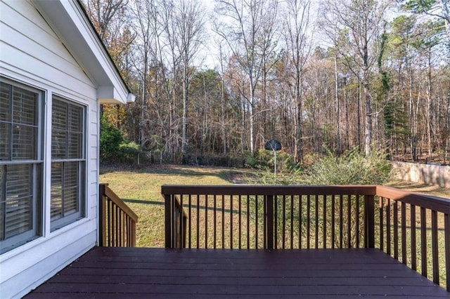 wooden deck featuring a yard