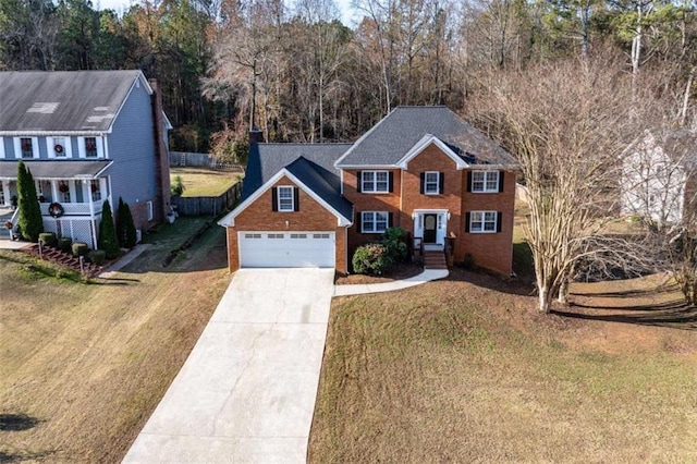 view of front facade with a front lawn and a garage