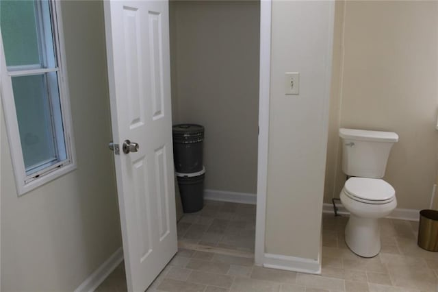 576 Nichols Rd, Pendergrass, GA 30567 - bathroom featuring baseboards, toilet, and tile patterned flooring