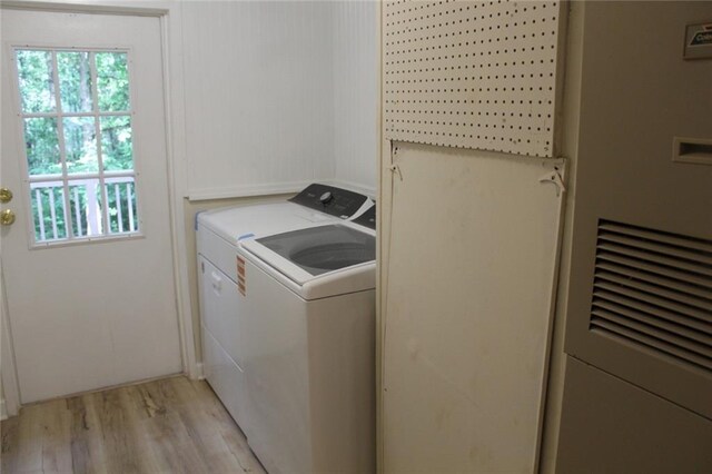 576 Nichols Rd, Pendergrass, GA 30567 - washroom with washer and dryer, light wood-style floors, and plenty of natural light