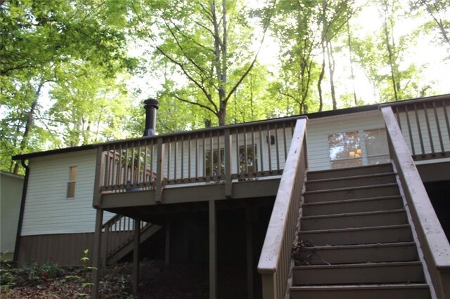 576 Nichols Rd, Pendergrass, GA 30567 - back of house with stairway and a wooden deck