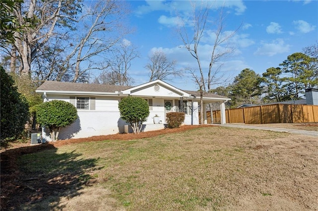 single story home featuring a front yard and a carport