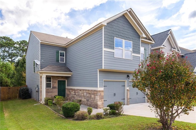 view of front of home with a garage and a front lawn