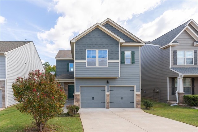 craftsman-style home featuring a garage and a front lawn