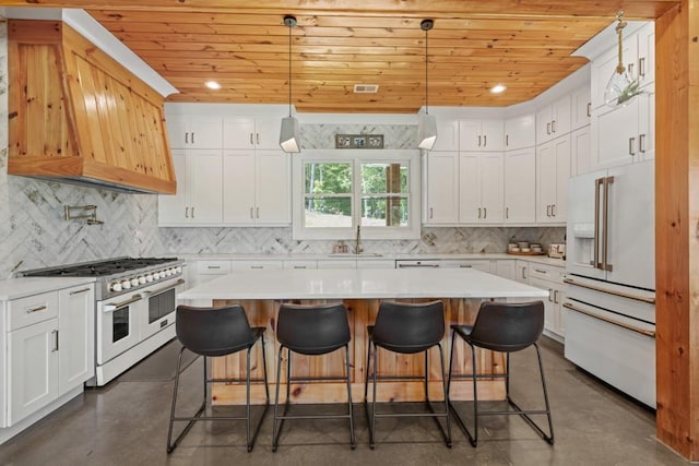 441 Pumpkinvine Rd, Acworth, GA 30101 - kitchen featuring a center island, finished concrete flooring, light countertops, high end appliances, and a sink