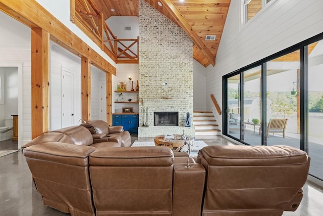 441 Pumpkinvine Rd, Acworth, GA 30101 - living area with visible vents, high vaulted ceiling, finished concrete floors, and a fireplace