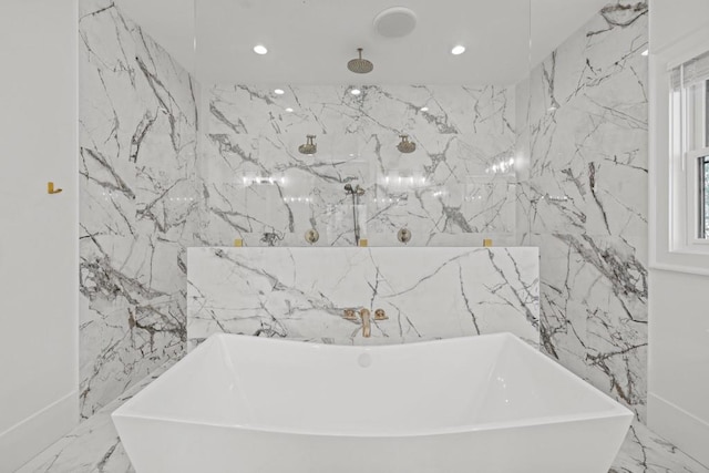 441 Pumpkinvine Rd, Acworth, GA 30101 - bathroom featuring a freestanding tub, marble finish floor, and stone wall