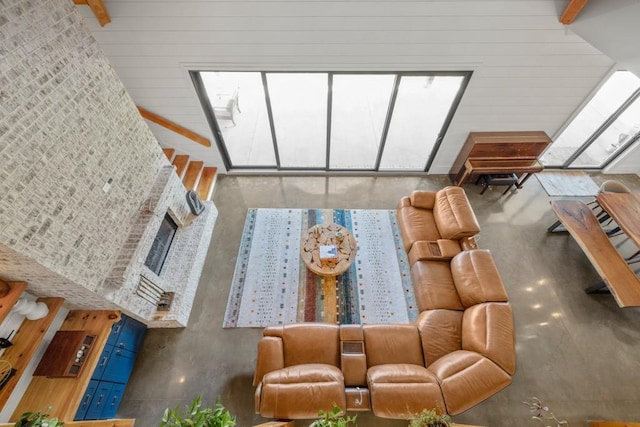 441 Pumpkinvine Rd, Acworth, GA 30101 - living area with beamed ceiling, a towering ceiling, and wood walls