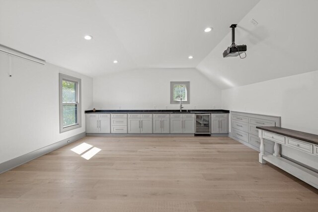 441 Pumpkinvine Rd, Acworth, GA 30101 - interior space featuring wine cooler, a healthy amount of sunlight, light wood-style flooring, and lofted ceiling