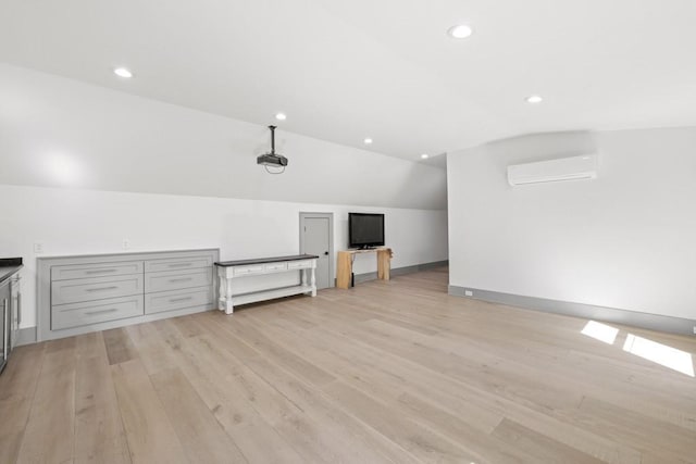 441 Pumpkinvine Rd, Acworth, GA 30101 - additional living space with lofted ceiling, light wood-style flooring, recessed lighting, and a wall mounted AC