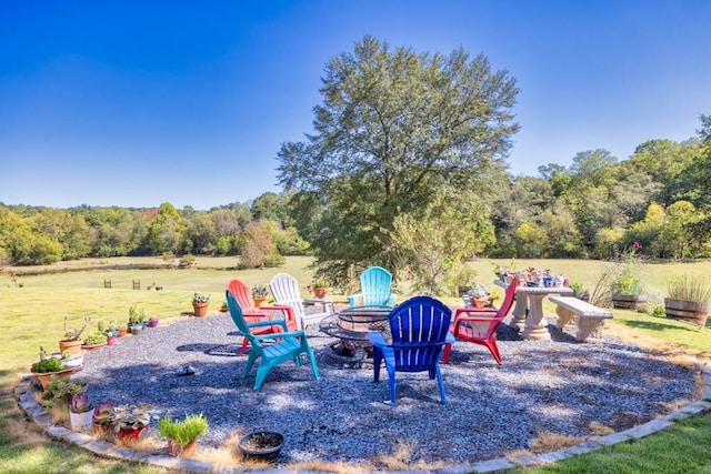 441 Pumpkinvine Rd, Acworth, GA 30101 - view of yard featuring a forest view, a patio area, and an outdoor fire pit
