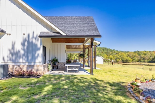441 Pumpkinvine Rd, Acworth, GA 30101 - view of yard featuring an outdoor structure, central air condition unit, and a patio area