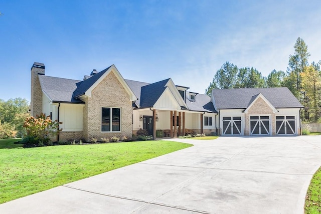 441 Pumpkinvine Rd, Acworth, GA 30101 - view of front of property featuring driveway, a front lawn, a garage, board and batten siding, and brick siding