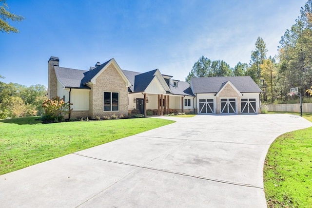 441 Pumpkinvine Rd, Acworth, GA 30101 - view of front of house with driveway, board and batten siding, a front yard, brick siding, and a chimney