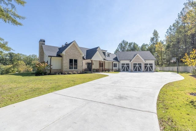 441 Pumpkinvine Rd, Acworth, GA 30101 - view of front of property featuring a front lawn, fence, concrete driveway, a garage, and a chimney