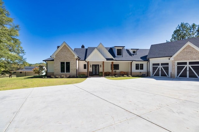 441 Pumpkinvine Rd, Acworth, GA 30101 - view of front of house with a front lawn, board and batten siding, and driveway