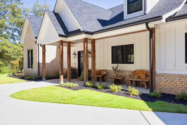 441 Pumpkinvine Rd, Acworth, GA 30101 - exterior space featuring brick siding, board and batten siding, and a shingled roof