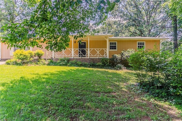 2783 Bicentennial Dr, Stone Mountain, GA 30087 - view of green lawn featuring a porch