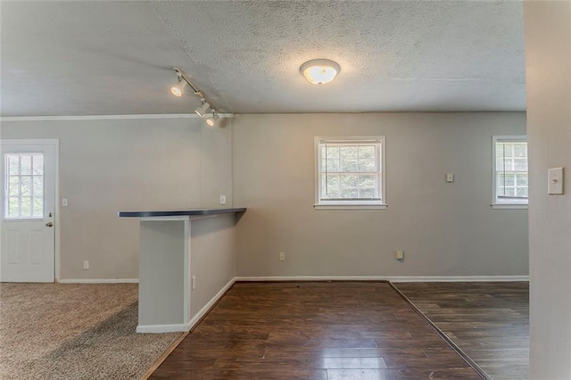 2783 Bicentennial Dr, Stone Mountain, GA 30087 - empty room featuring plenty of natural light, wood finished floors, a textured ceiling, and ornamental molding