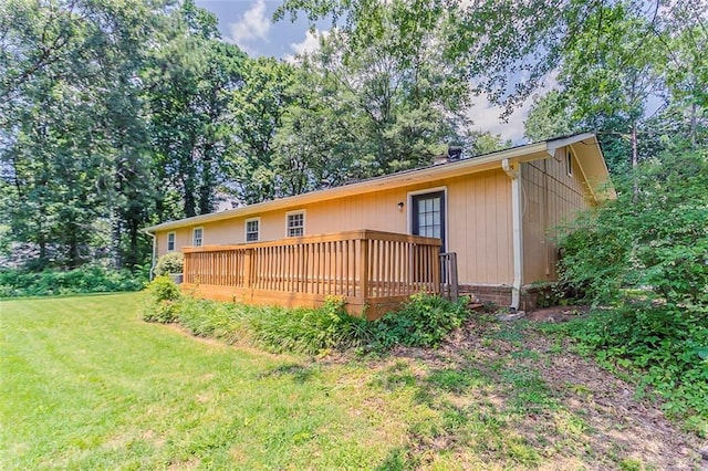 2783 Bicentennial Dr, Stone Mountain, GA 30087 - back of property featuring a yard and a wooden deck