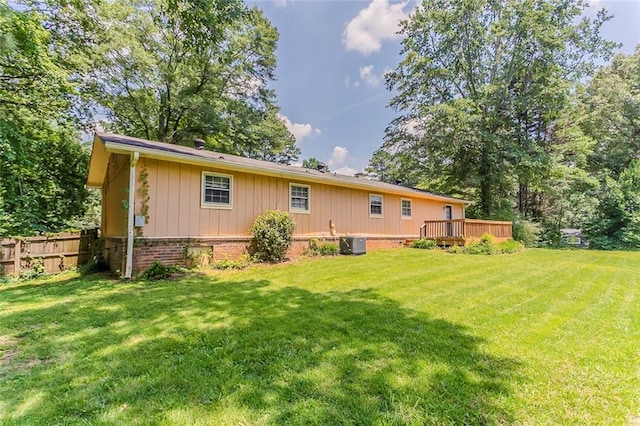 2783 Bicentennial Dr, Stone Mountain, GA 30087 - rear view of property with a deck and brick siding
